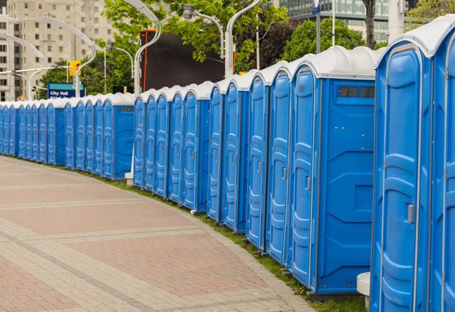 a row of portable restrooms set up for a large athletic event, allowing participants and spectators to easily take care of their needs in Centreville, VA